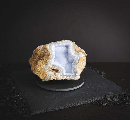 Raw lace mineral on a pedestal.
