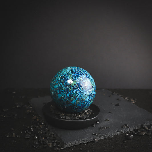 Multicoloured mineral sphere.