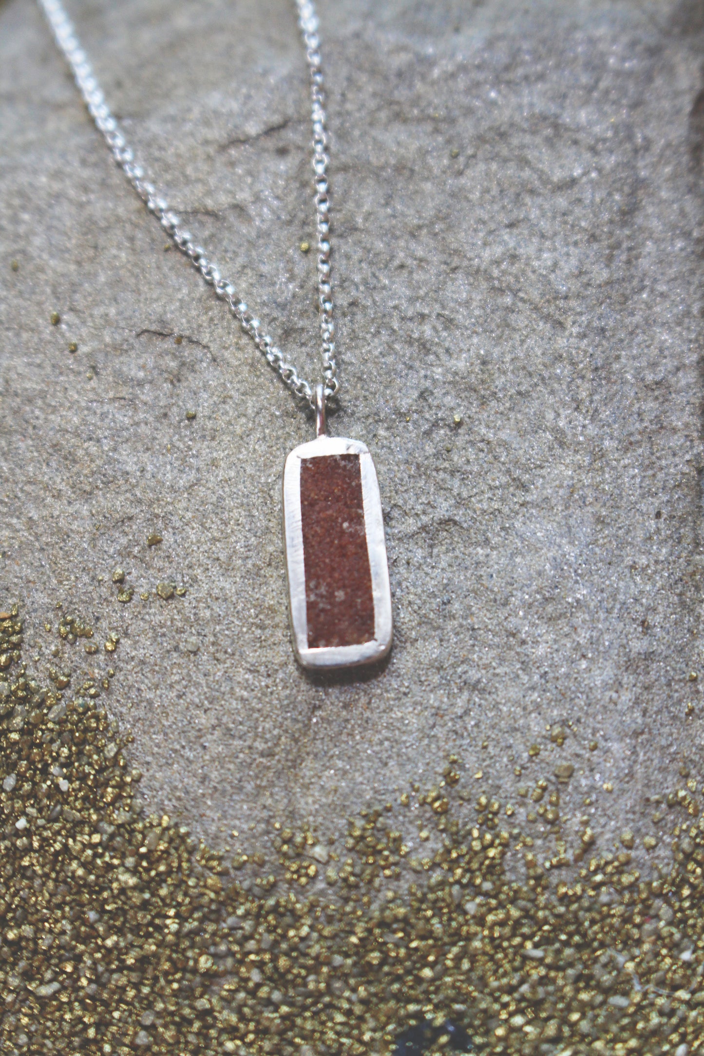 rectangular silver pendant with Sahara sand inlay