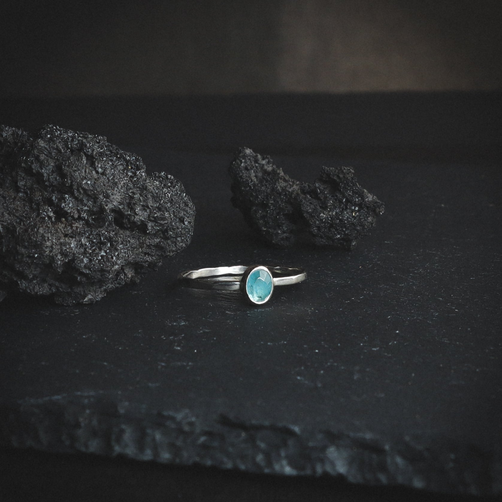 handmade silver ring with a light blue rose cut gemstone