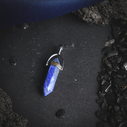 Polished sparkling lapis lazuli pendant.