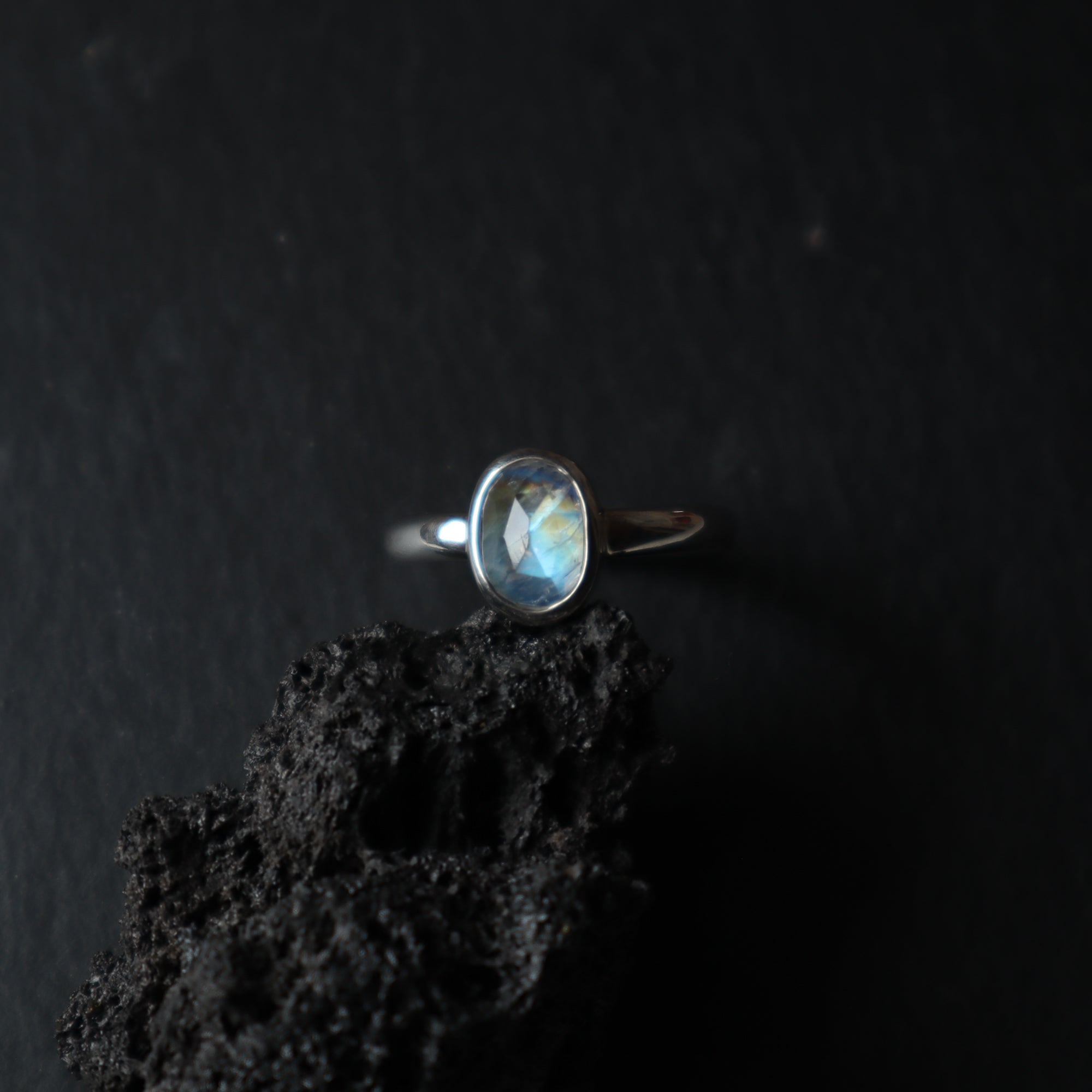 dark, silver ring with rose cut moonstone gemstone