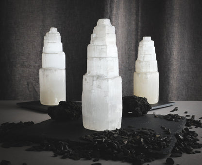 Selenite towers against dark background.